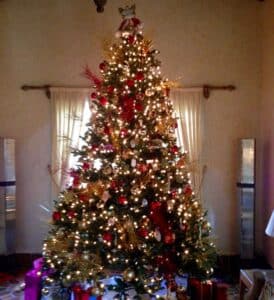 A lit up decorated Christmas tree.